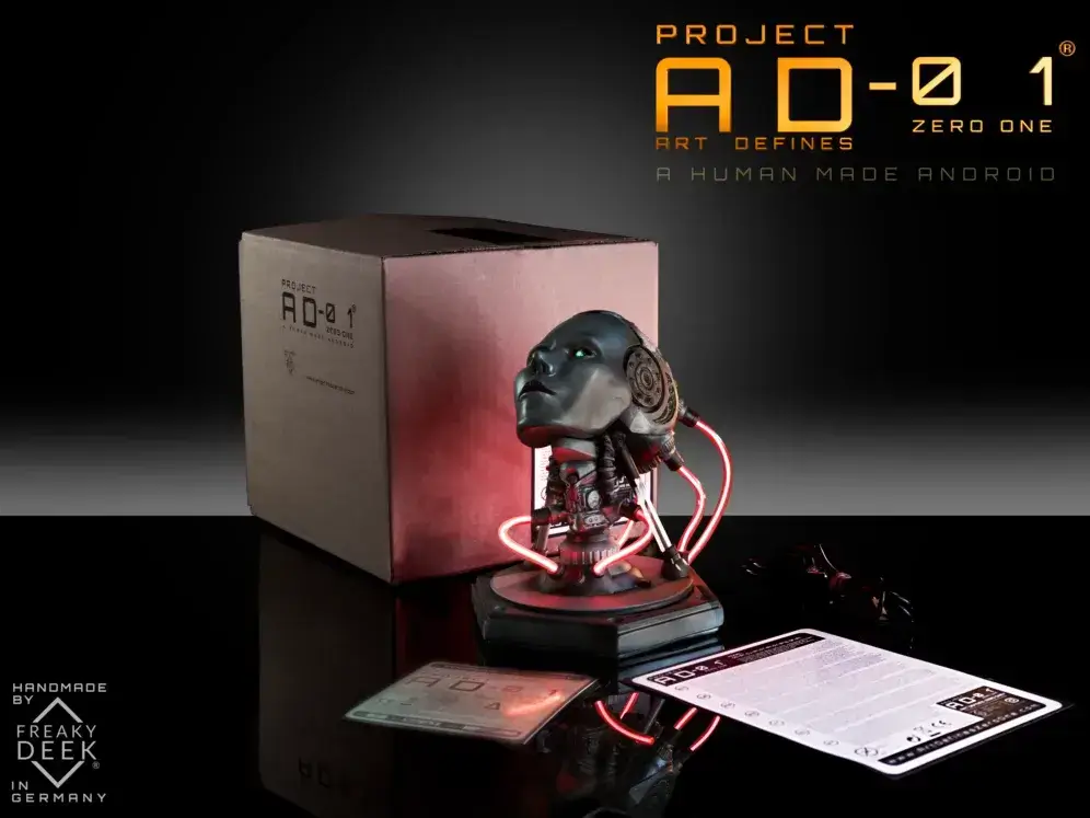 PROJECT AD-01 JOULE Shipping Content Shipping content of freaky-Deek's Project AD-01 JOULE handmade sculpture bust with USB cable, android, instructions manual. and signed certificate of authenticity, LED light bust